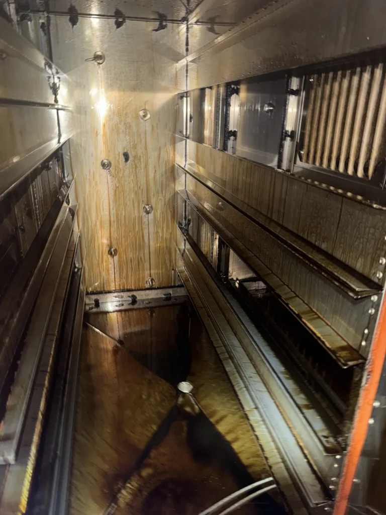 Grease buildup inside a commercial kitchen exhaust filtration unit